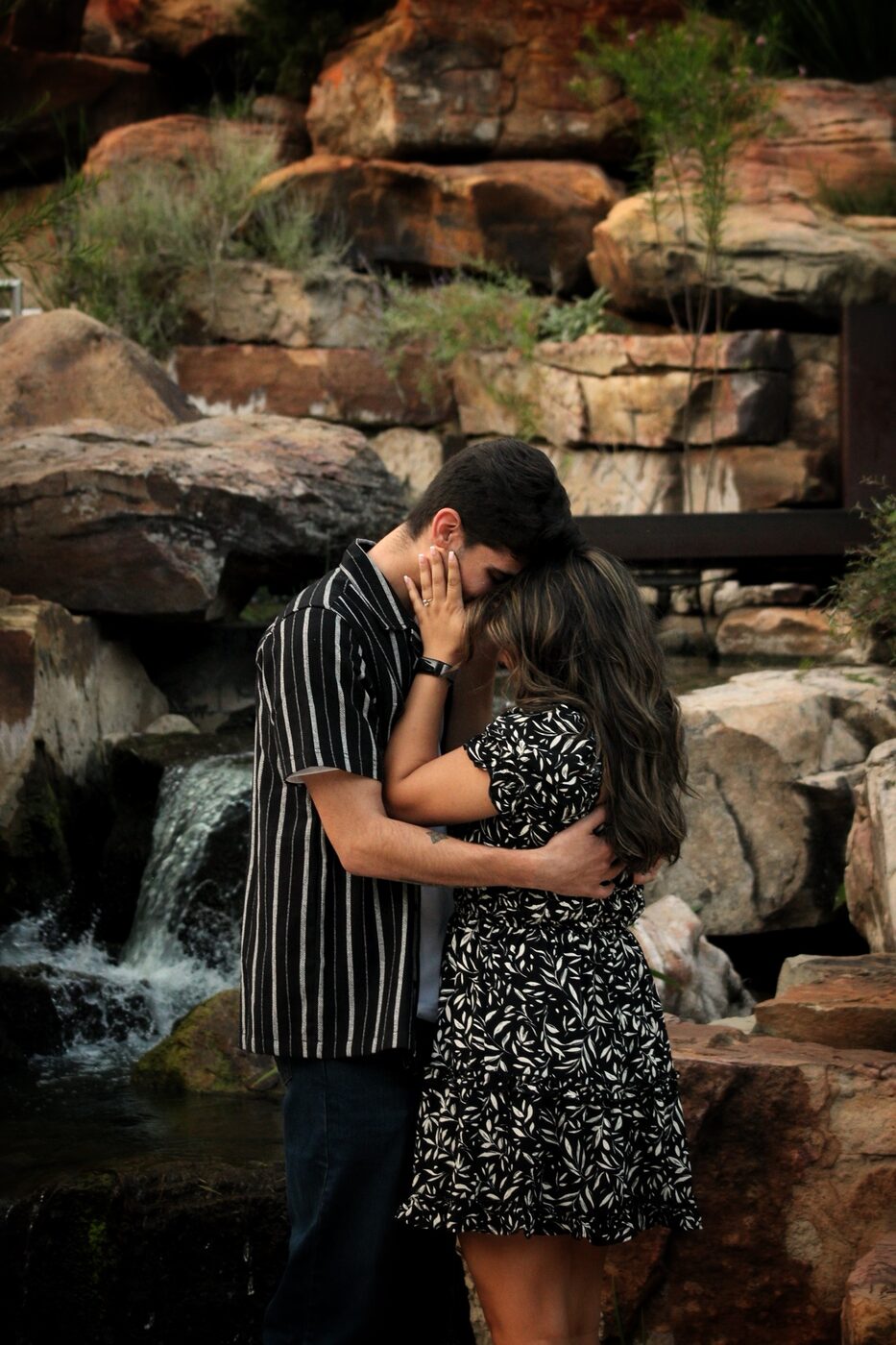 Couple laughing, foreheads close